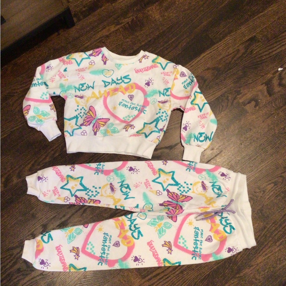 PRIMARK -children's tracksuit featuring a colorful all-over graffiti-style print
